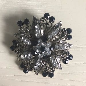 Black and silver brooch with rhinestones
